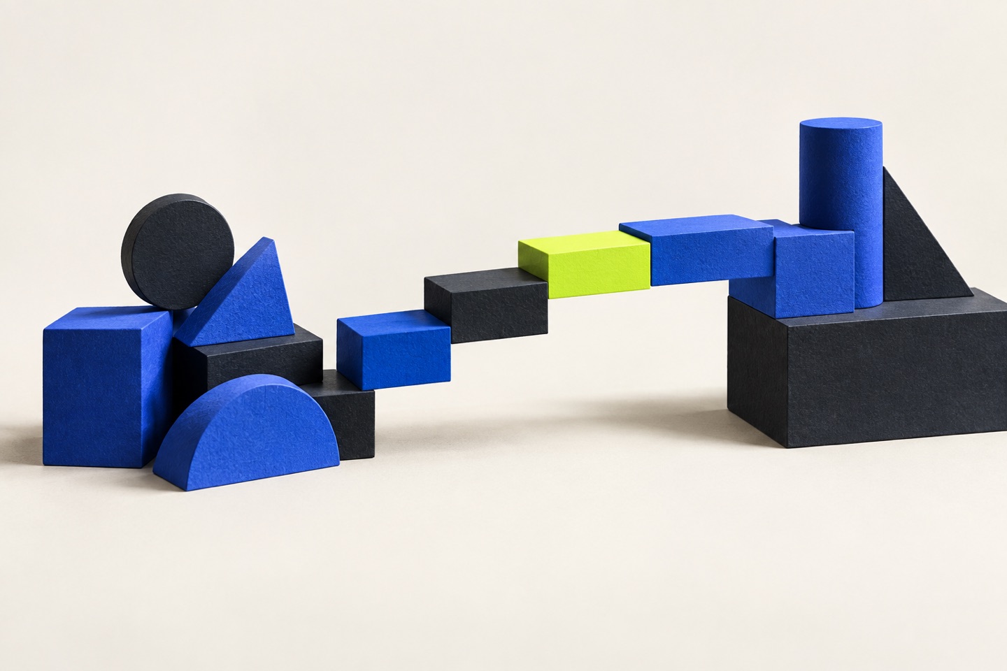 Cobalt and charcoal geometric blocks form a new bridge, joined by a bright lime block.